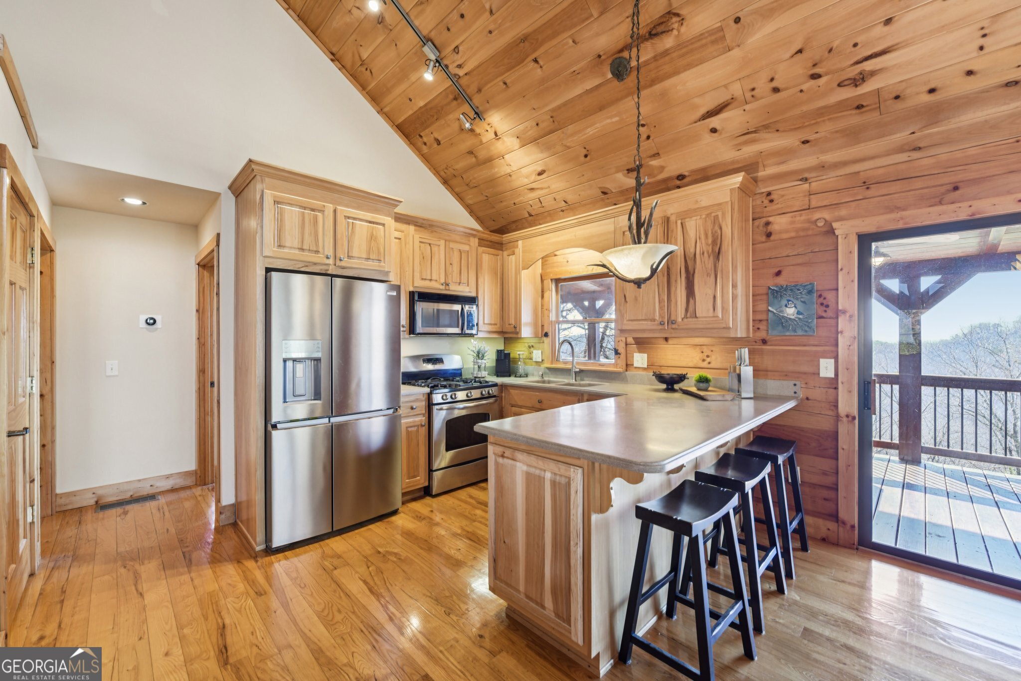 232 Ranch Mountain Drive Dahlonega, GA 30533 - Photo 19 of 78 a kitchen with stainless steel appliances granite countertop a sink a stove and refrigerator