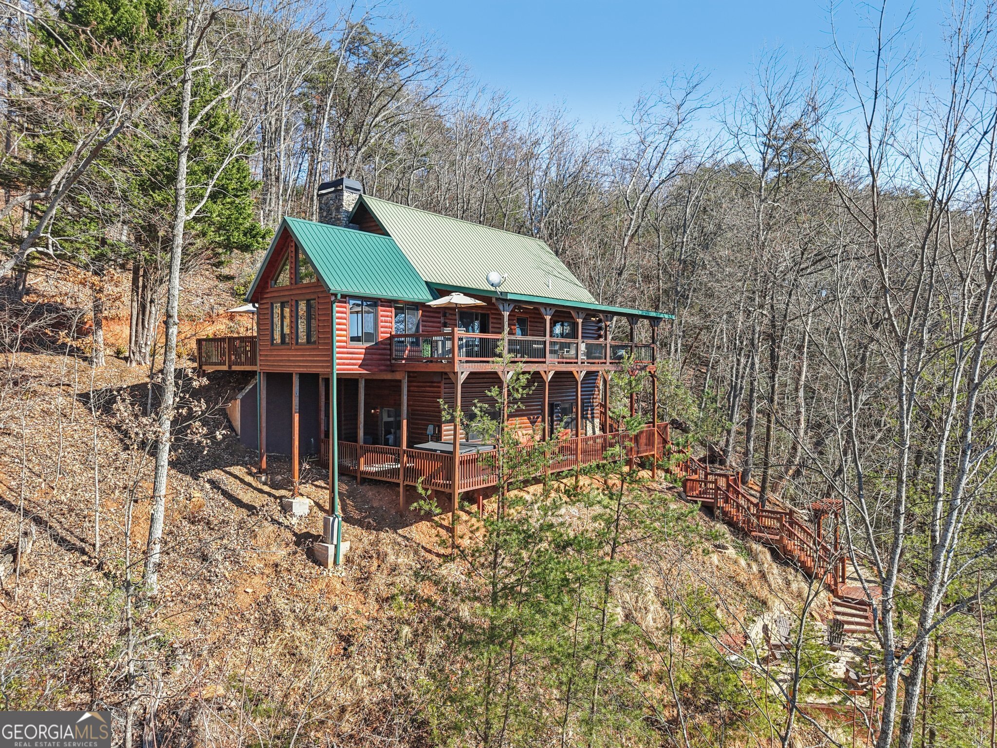 232 Ranch Mountain Drive Dahlonega, GA 30533 - Photo 2 of 78 a view of a house with a yard from a balcony