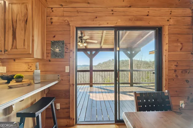 a view of a patio with glass top table and chairs