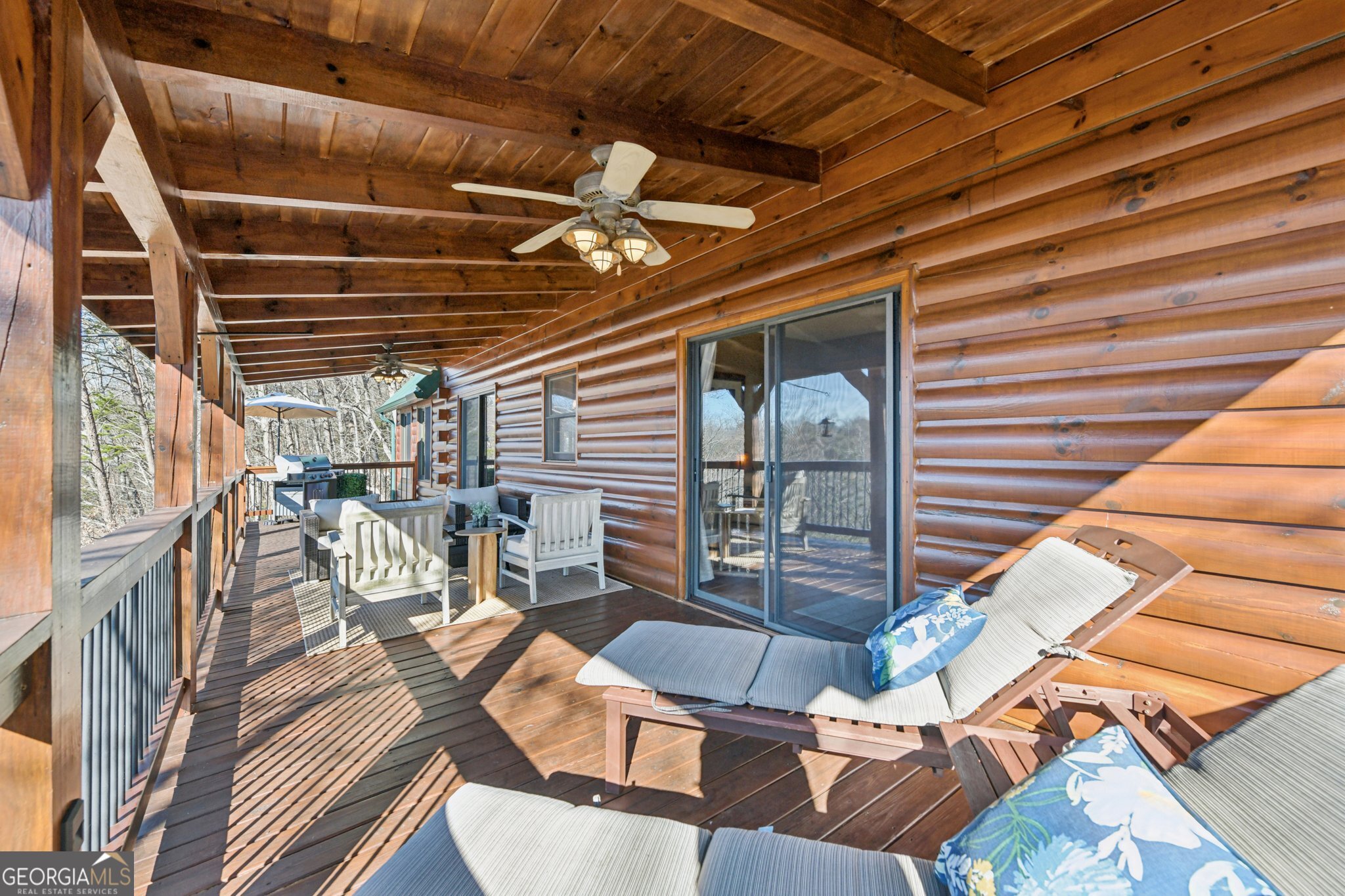232 Ranch Mountain Drive Dahlonega, GA 30533 - Photo 26 of 78 a view of a patio with glass top table and chairs