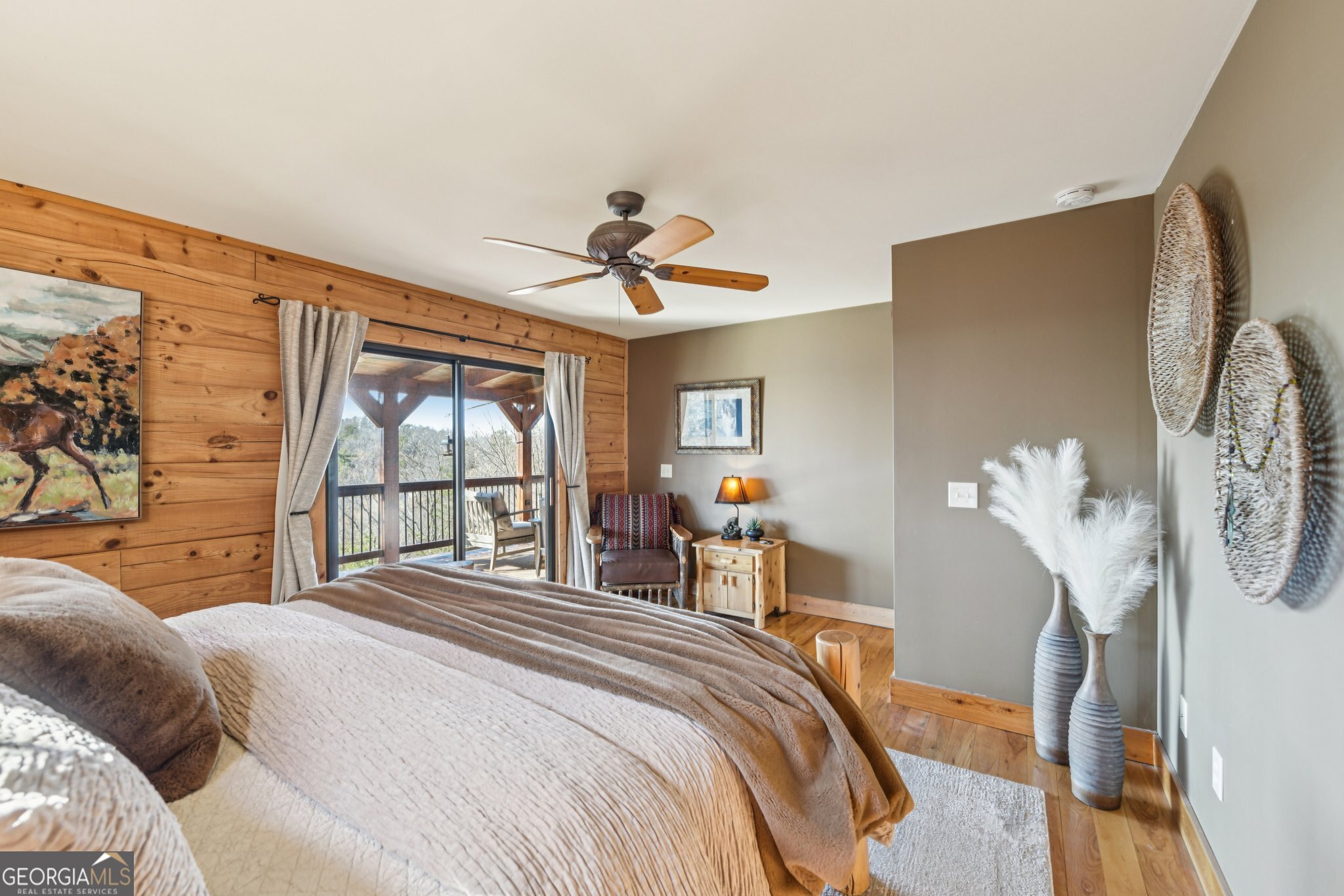 232 Ranch Mountain Drive Dahlonega, GA 30533 - Photo 27 of 78 a bedroom with a large bed and a chandelier