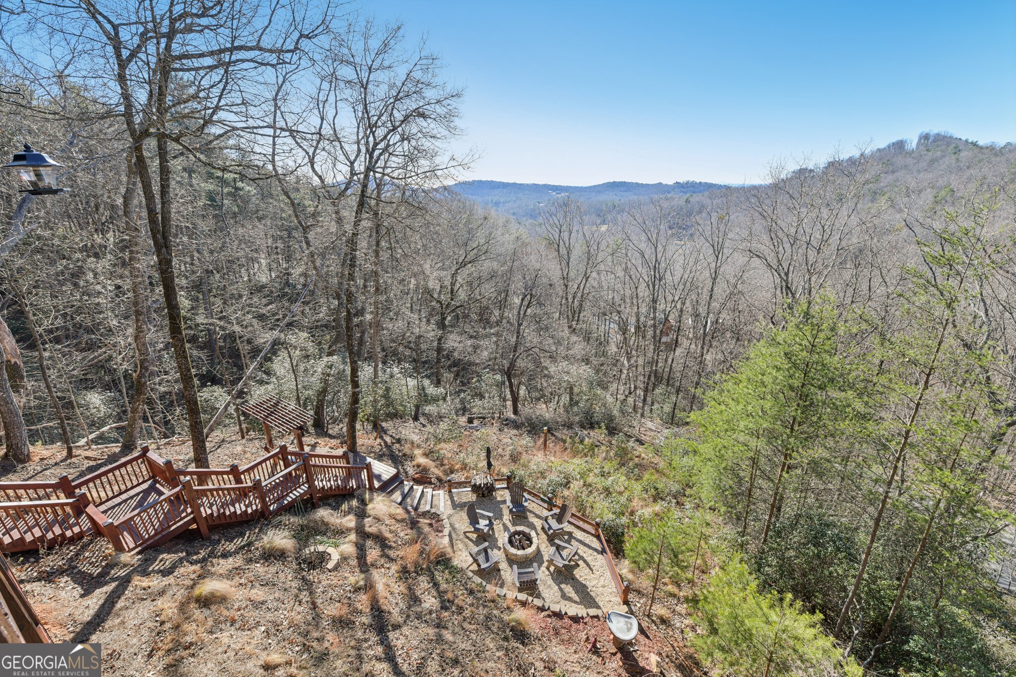232 Ranch Mountain Drive Dahlonega, GA 30533 - Photo 3 of 78 a view of a dry yard with mountains in the background