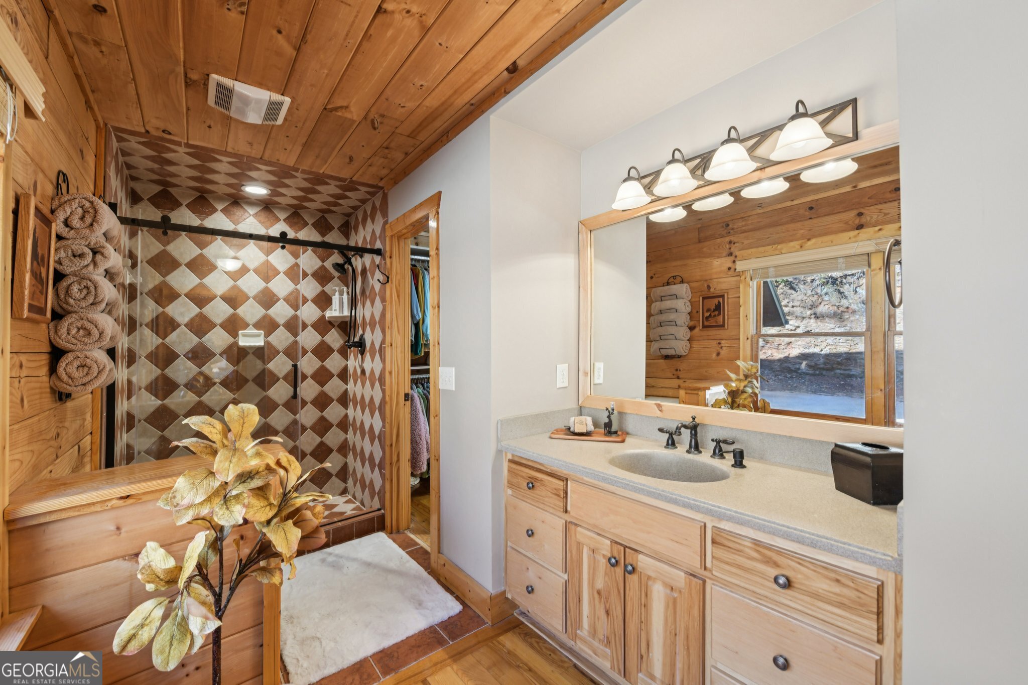 232 Ranch Mountain Drive Dahlonega, GA 30533 - Photo 32 of 78 a bathroom with a double vanity sink mirror and shower