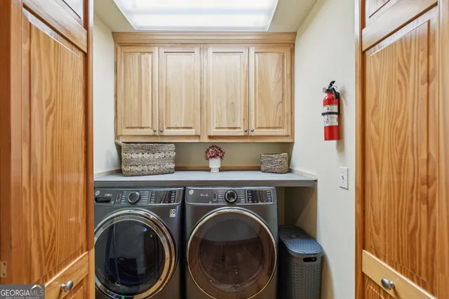 a close view of a utility room with dryer and door