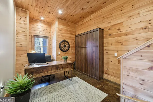 a bathroom with a granite countertop sink a toilet a mirror and shower