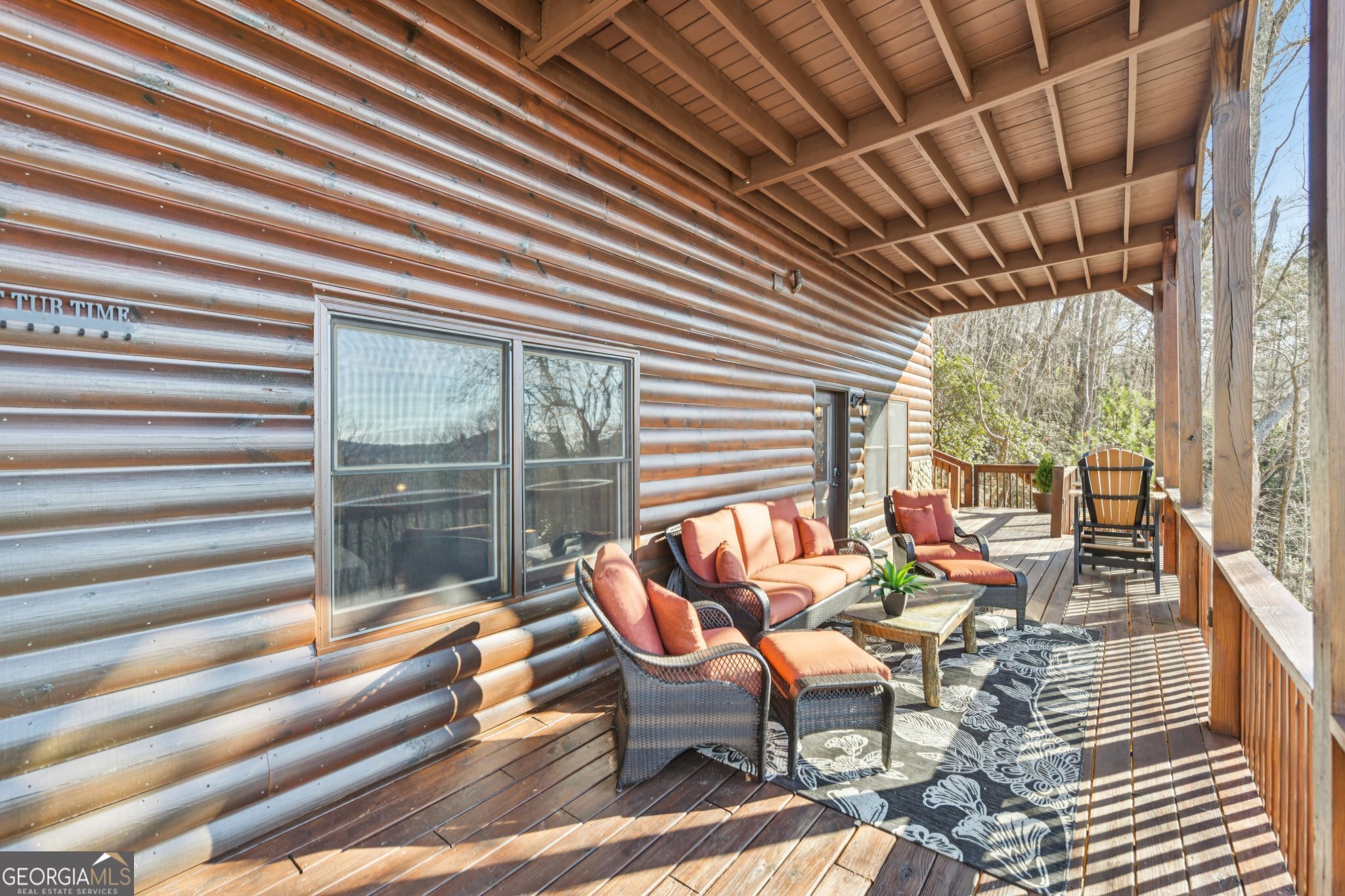 232 Ranch Mountain Drive Dahlonega, GA 30533 - Photo 49 of 78 a living room with furniture and a floor to ceiling window