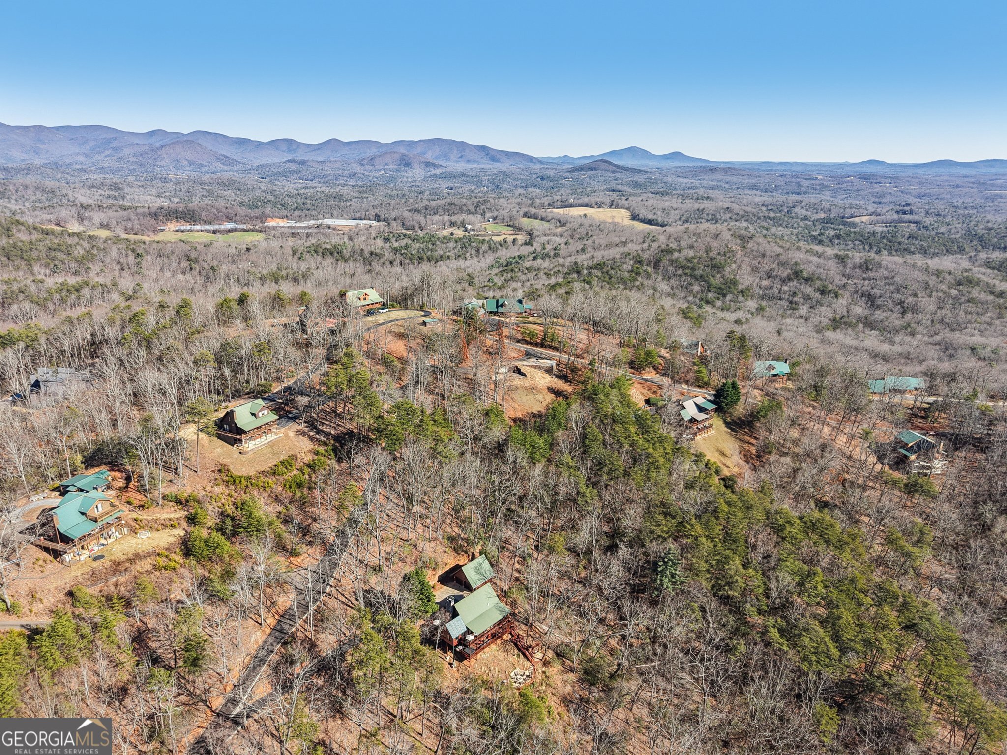 232 Ranch Mountain Drive Dahlonega, GA 30533 - Photo 69 of 78 a view of a lush green field with mountains in the background