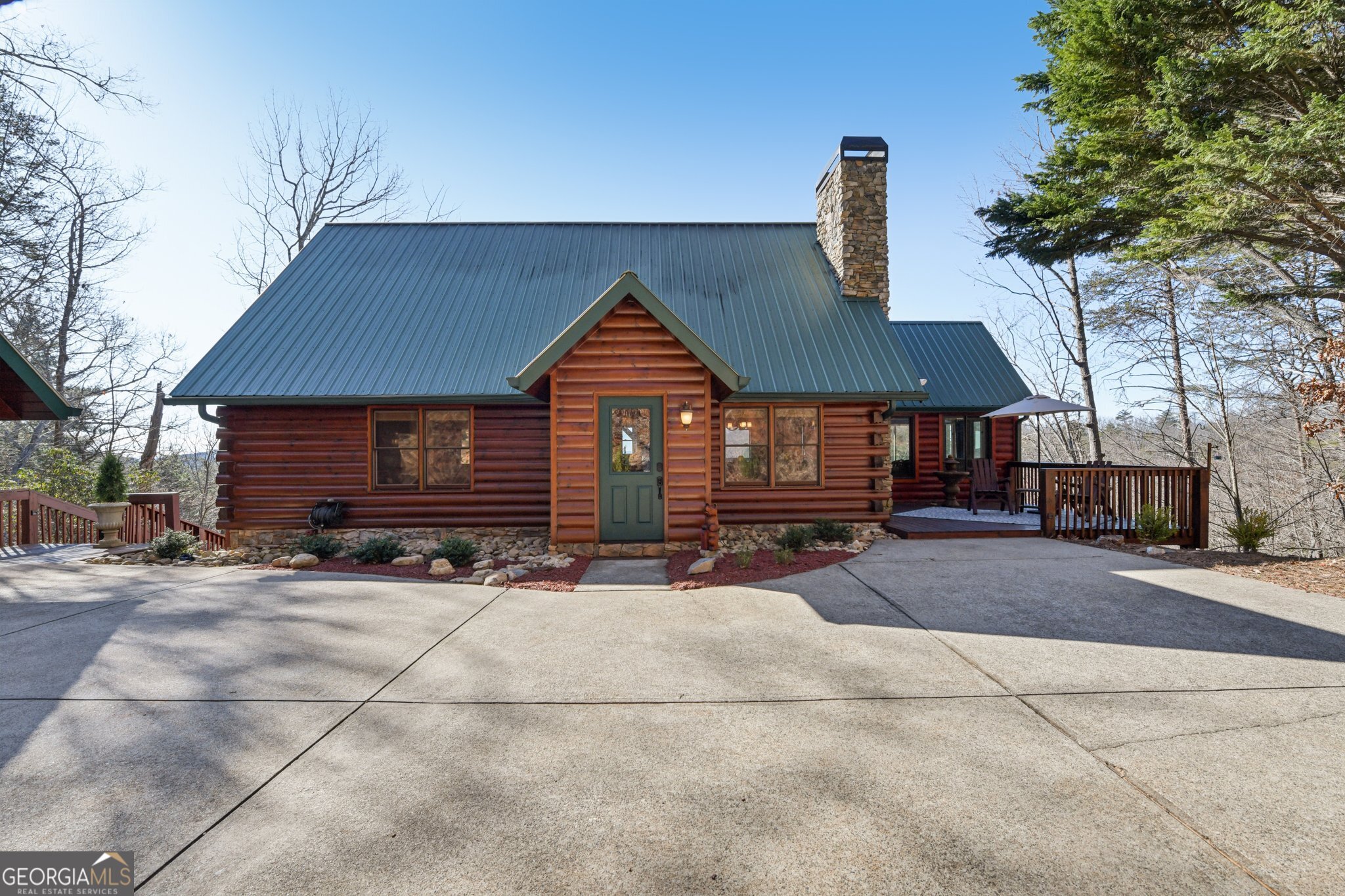 232 Ranch Mountain Drive Dahlonega, GA 30533 - Photo 7 of 78 a front view of a house with garden