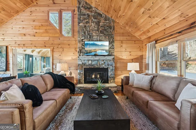 a media room with lots of chairs and a table