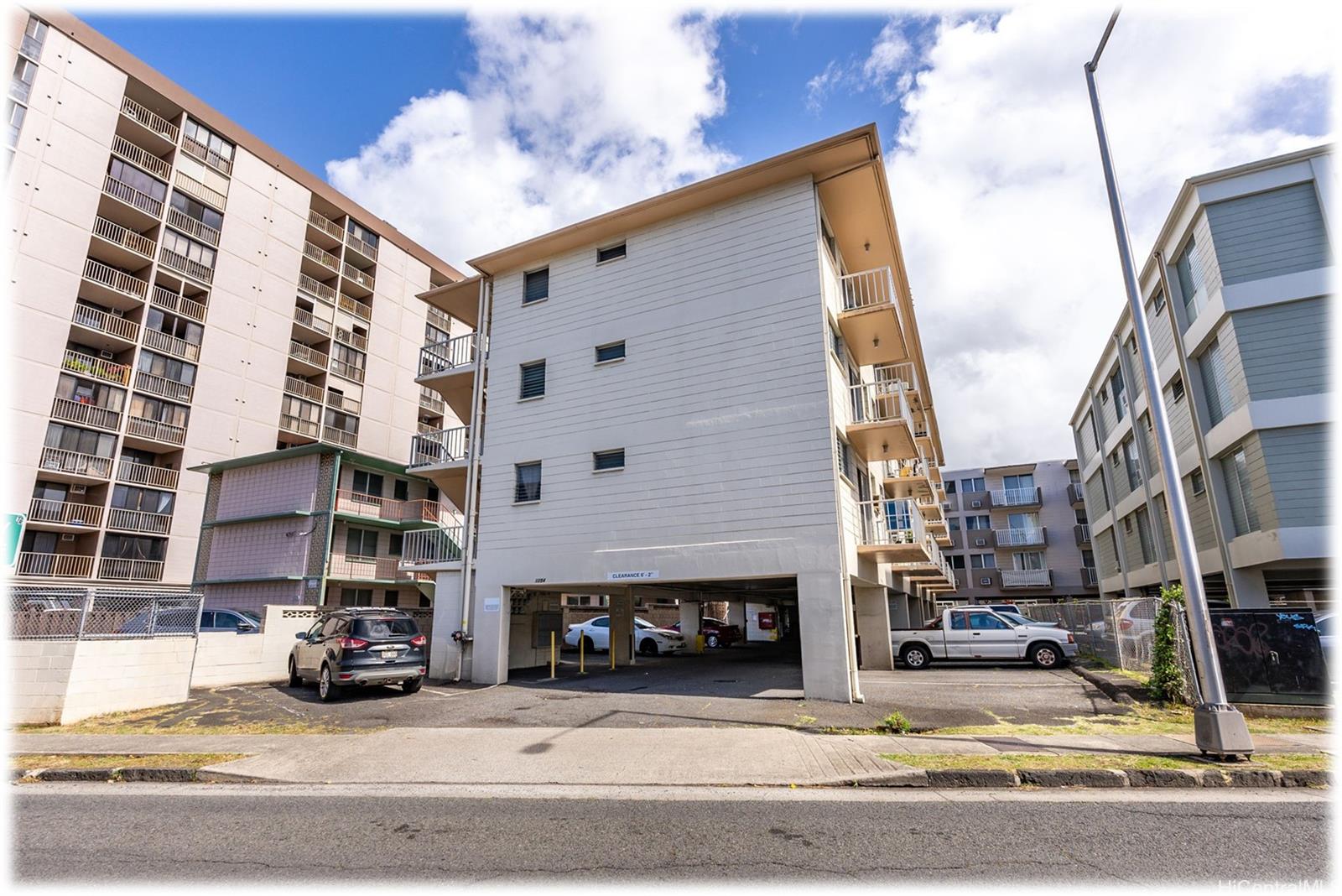 a view of a building and car parked