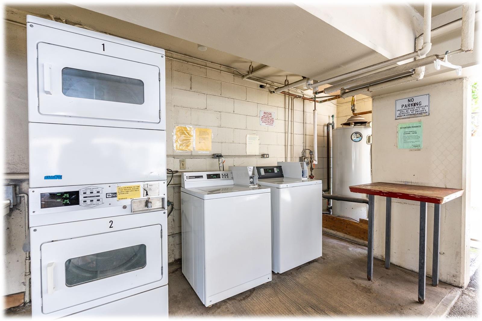 1254 Lunalilo Street Honolulu, HI 96822 - Photo 13 of 13 a kitchen with a stove and a refrigerator