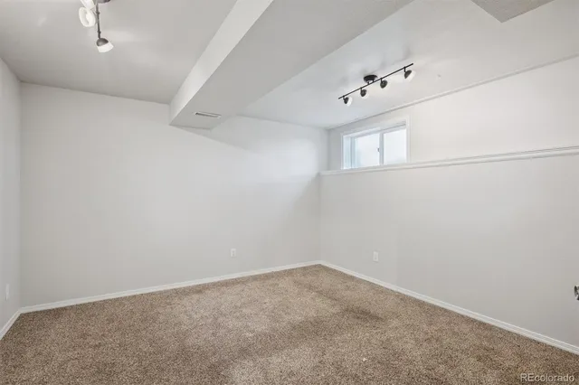 an empty room with a windows