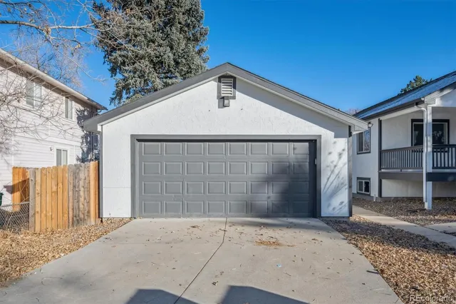 a front view of a house with a garage