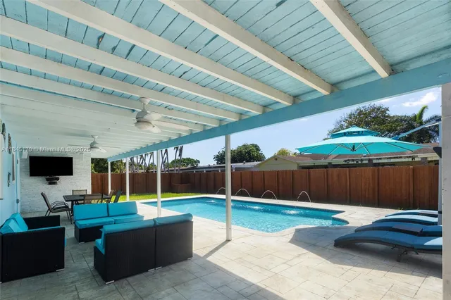 a view of swimming pool with a patio