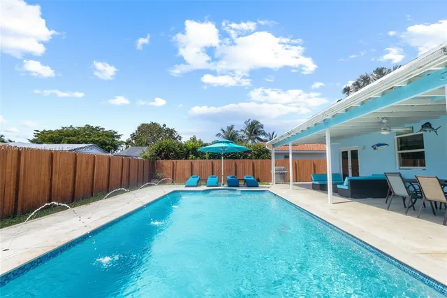 a view of a backyard with a patio