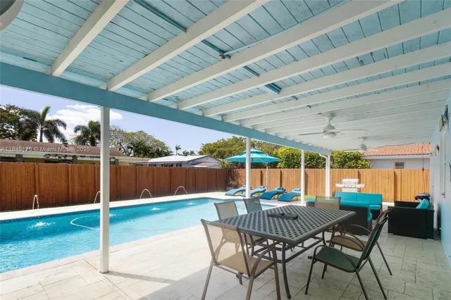 a outdoor space with a table tennis table and chair