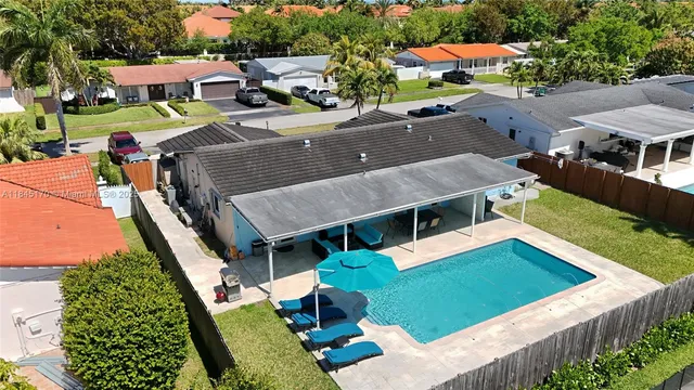 an aerial view of a house with a garden