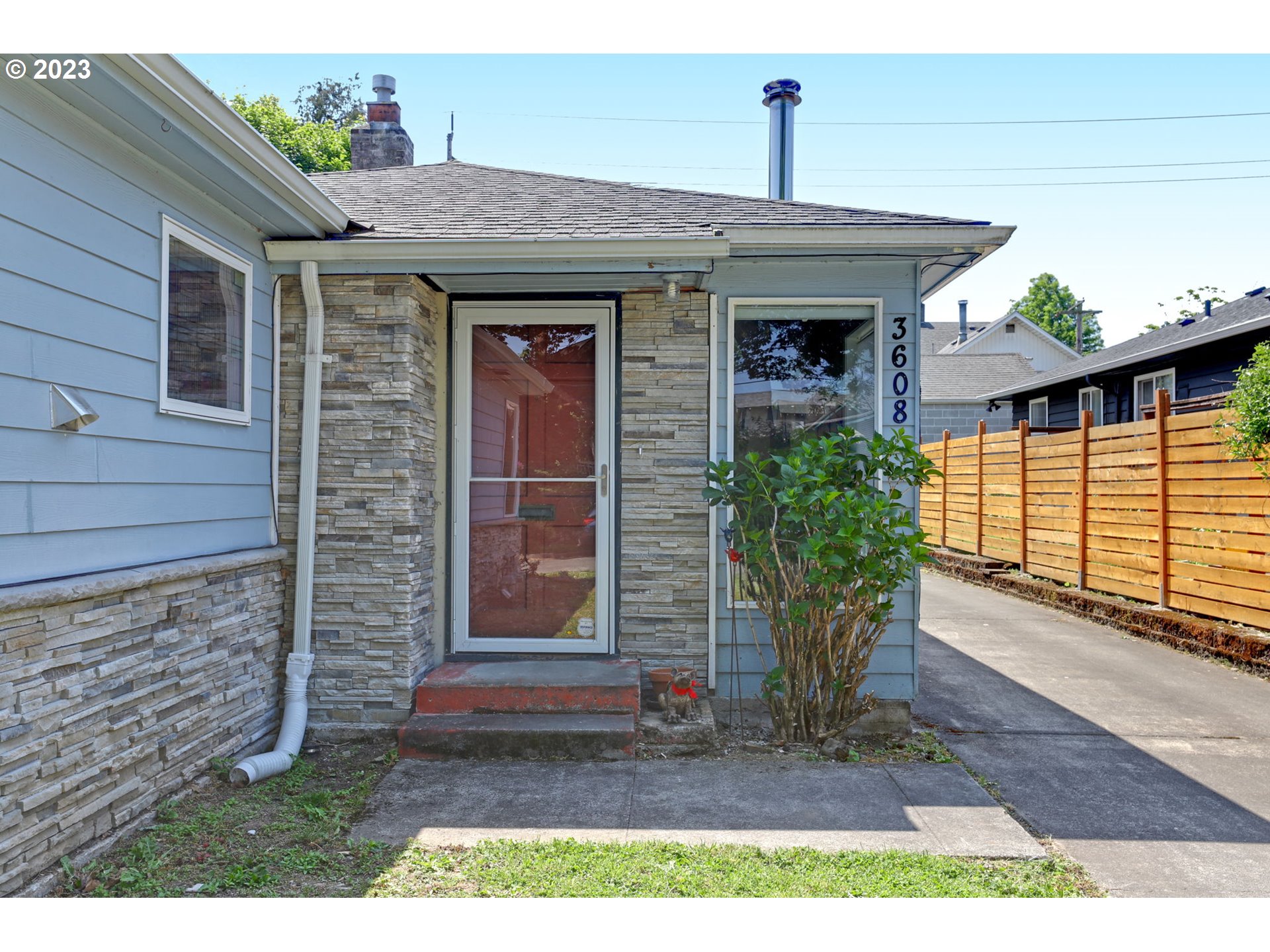 3608 Southeast Center Street Portland, OR 97202 - Photo 12 of 27 a front view of a house with garden