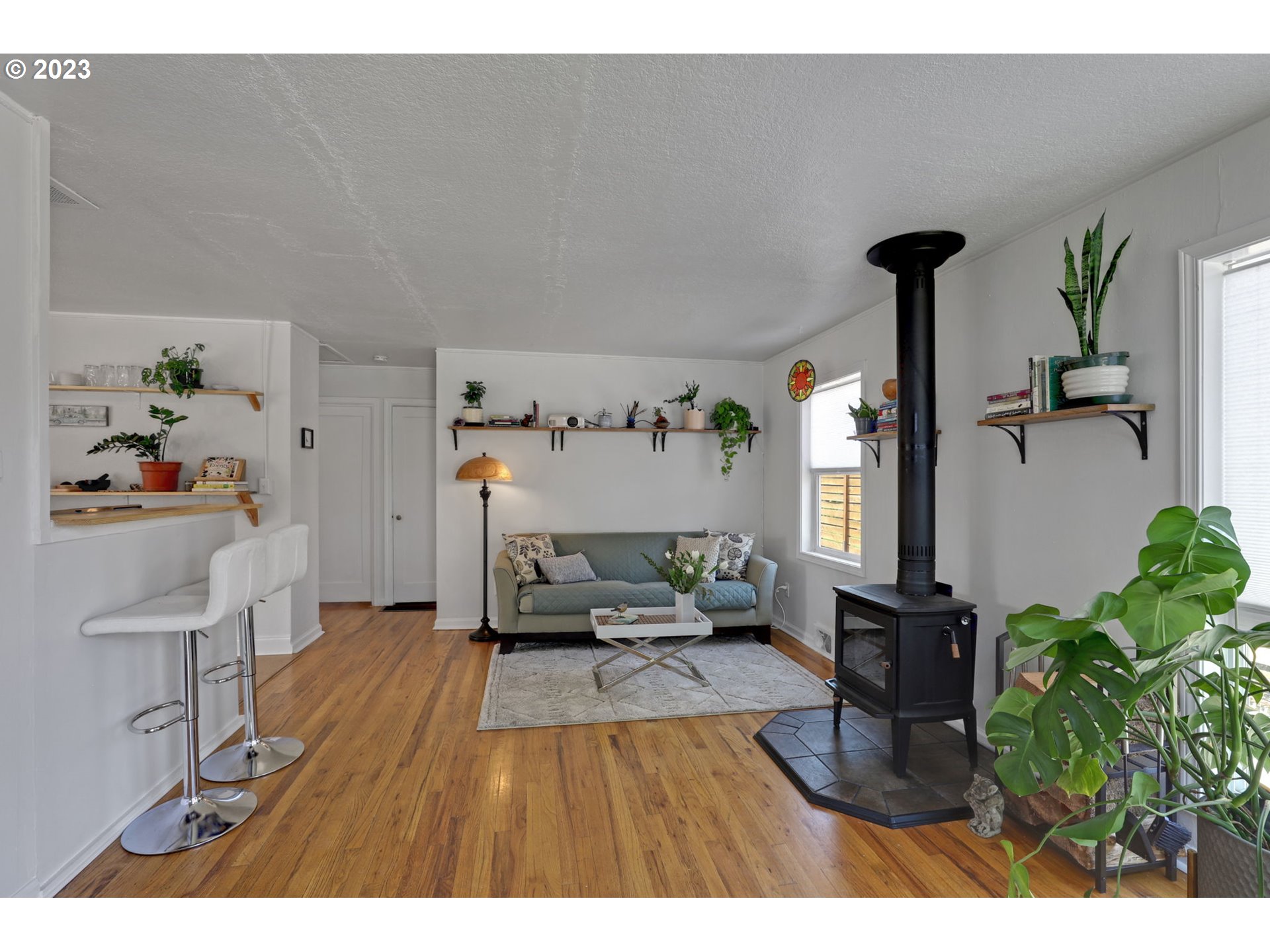 3608 Southeast Center Street Portland, OR 97202 - Photo 13 of 27 a living room with furniture and a wooden floor