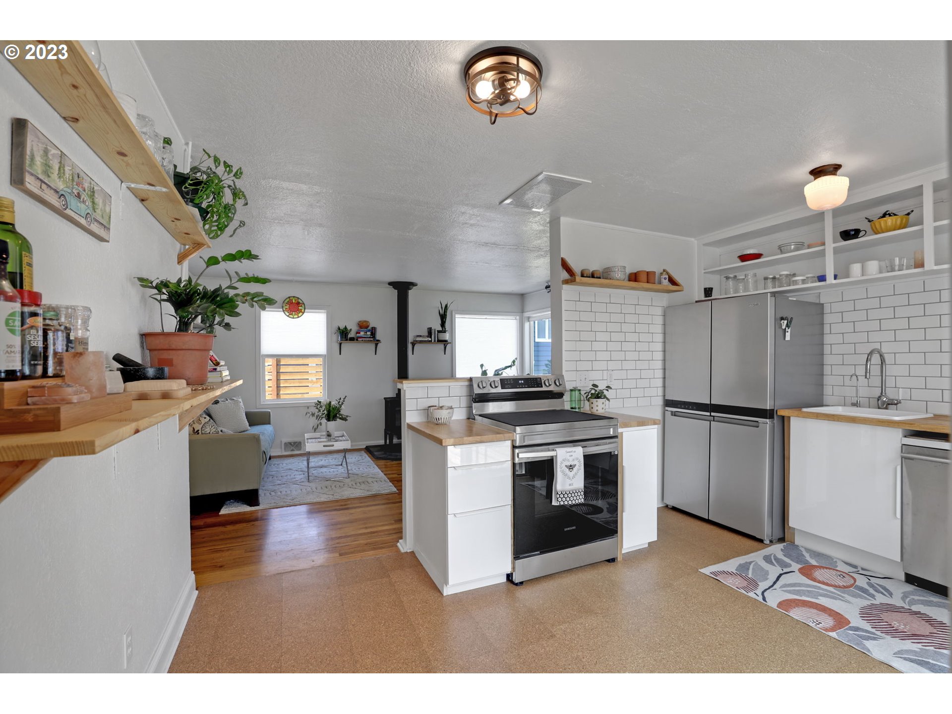 3608 Southeast Center Street Portland, OR 97202 - Photo 16 of 27 a kitchen with a refrigerator and a stove