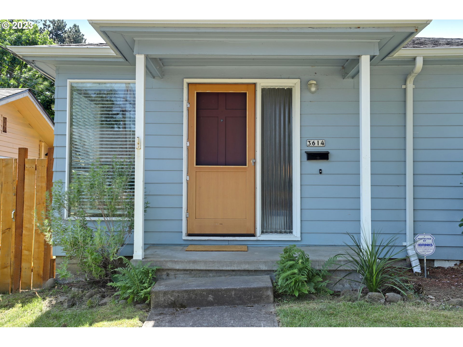 3608 Southeast Center Street Portland, OR 97202 - Photo 19 of 27 a front view of a house with a yard