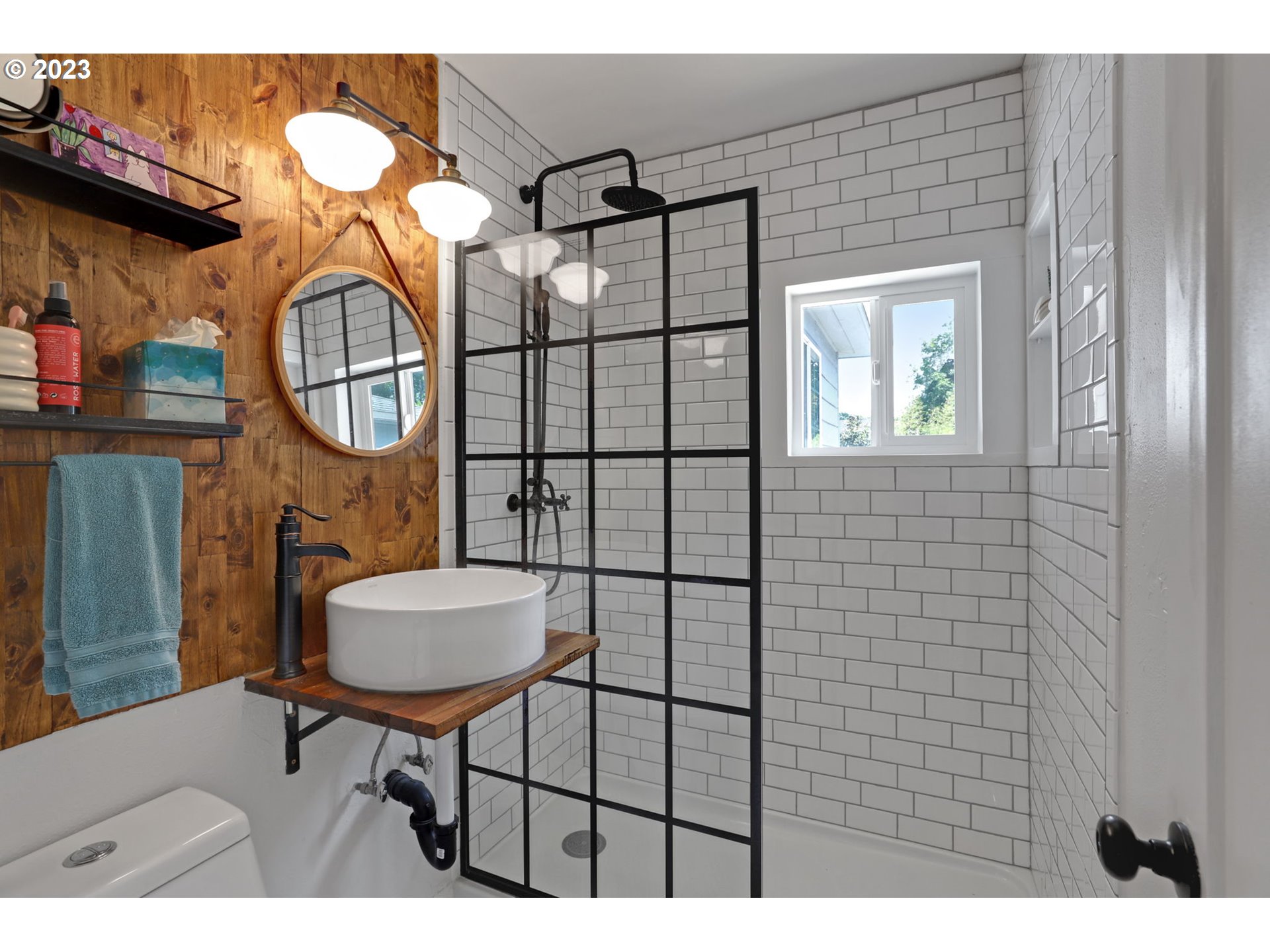 3608 Southeast Center Street Portland, OR 97202 - Photo 23 of 27 a bathroom with a toilet a sink and mirror