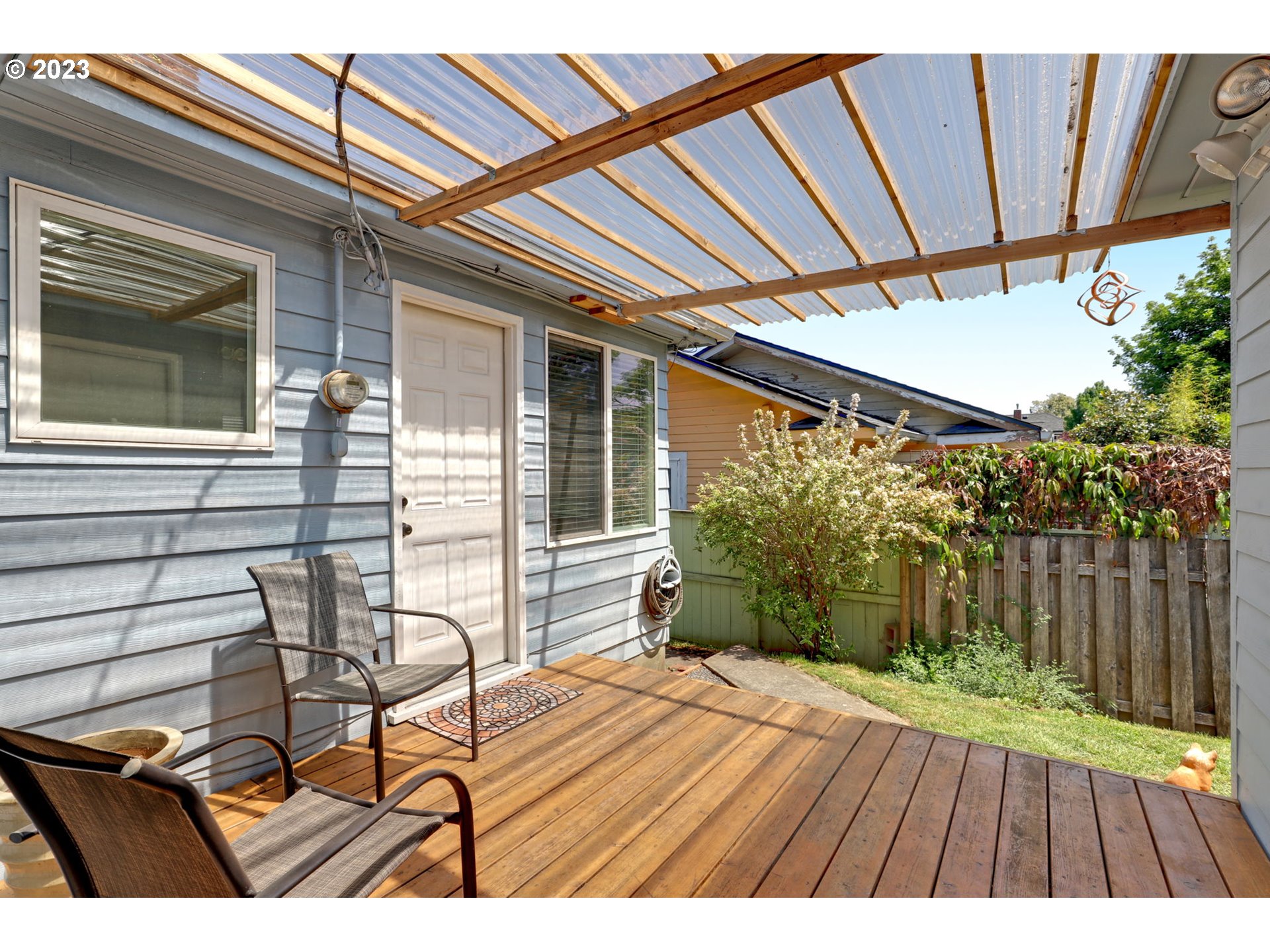 3608 Southeast Center Street Portland, OR 97202 - Photo 25 of 27 a view of patio with table and chairs and potted plants with wooden floor