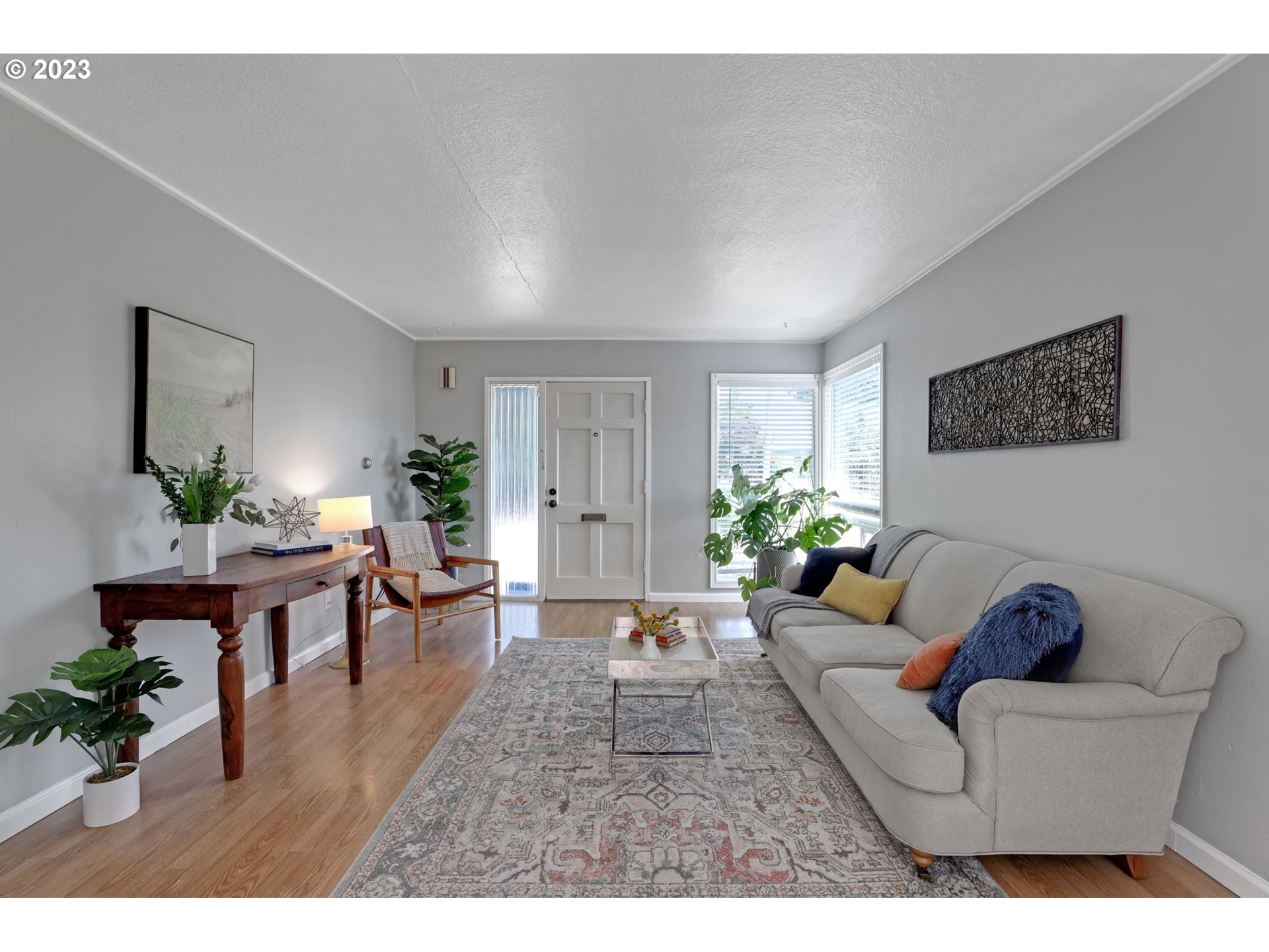 3608 Southeast Center Street Portland, OR 97202 - Photo 3 of 27 a living room with furniture and a potted plant
