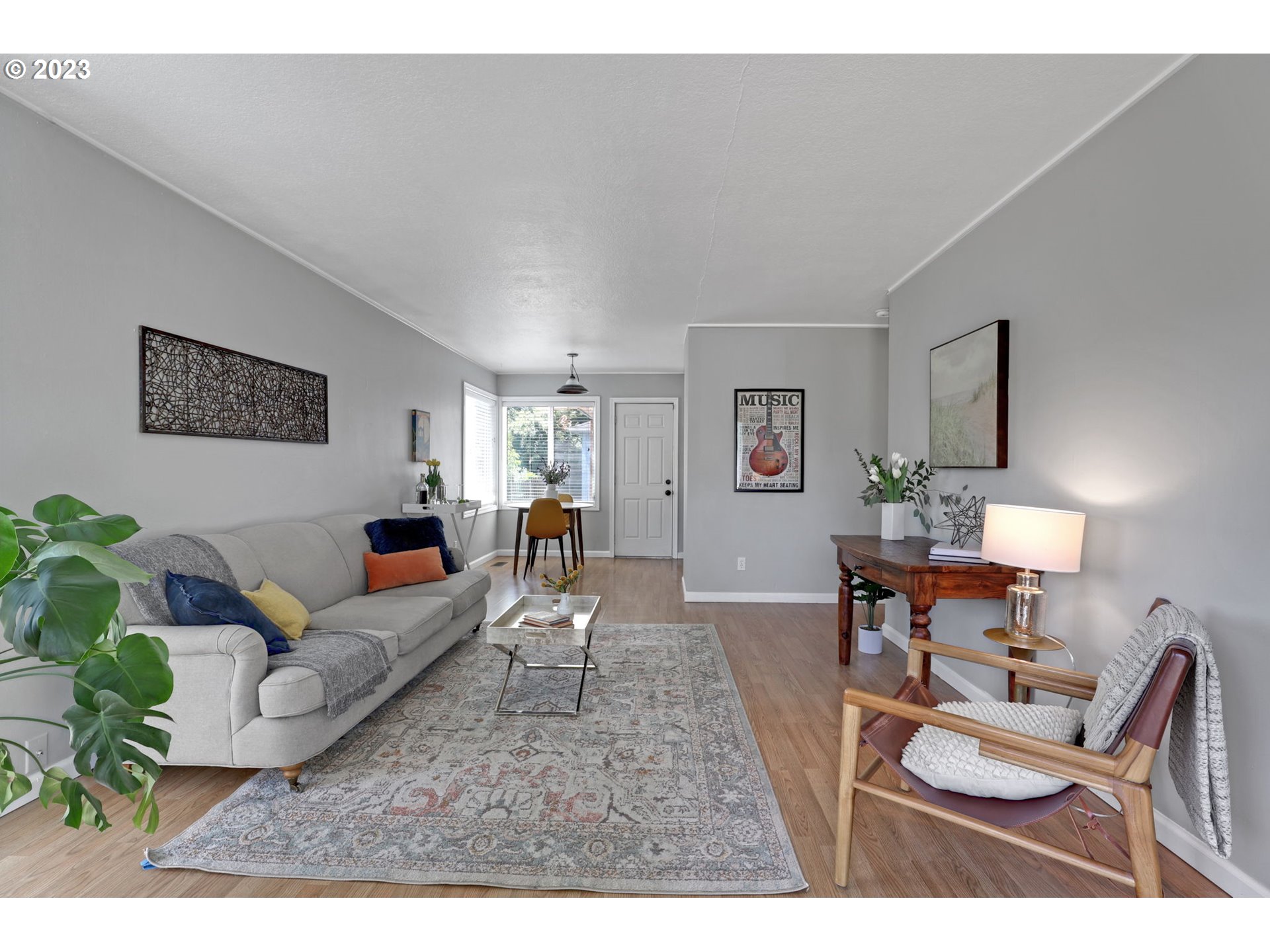 3608 Southeast Center Street Portland, OR 97202 - Photo 4 of 27 a living room with furniture and a wooden floor