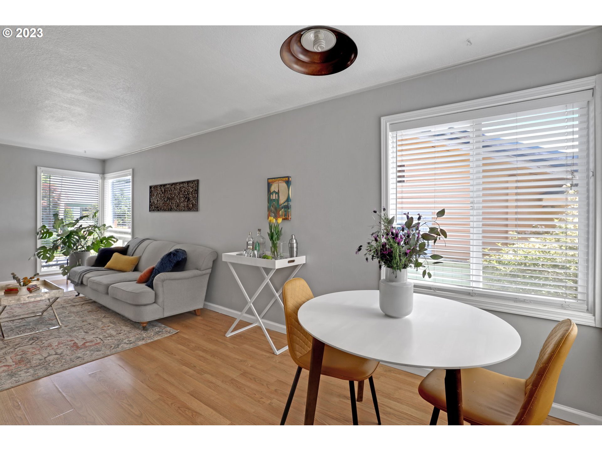 3608 Southeast Center Street Portland, OR 97202 - Photo 7 of 27 a view of a dining room with furniture and wooden floor