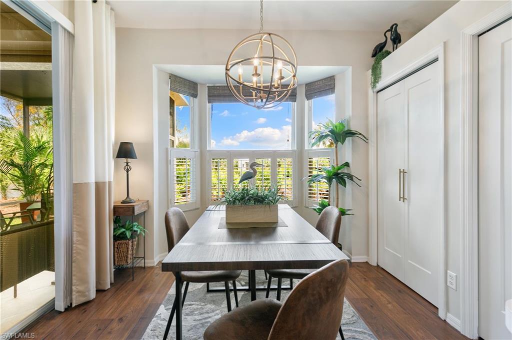 21445 Knighton Run Estero, FL 33928 - Photo 14 of 48 a view of a dining room with furniture window and wooden floor
