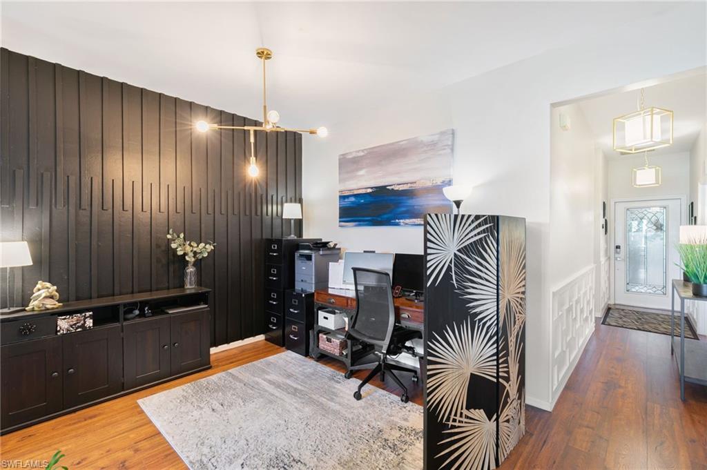 21445 Knighton Run Estero, FL 33928 - Photo 27 of 48 a balcony with chairs and wooden floor