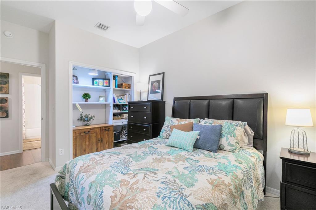 21445 Knighton Run Estero, FL 33928 - Photo 29 of 48 a bedroom with a bed and closet