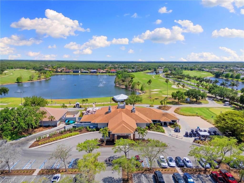 21445 Knighton Run Estero, FL 33928 - Photo 3 of 48 an aerial view of a city with lots of residential buildings ocean and mountain view in back