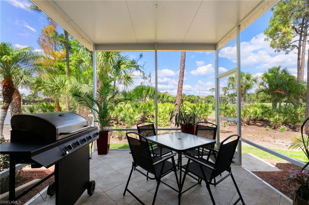 21445 Knighton Run Estero, FL 33928 - Photo 34 of 48 a outdoor dining space with furniture and outdoor view