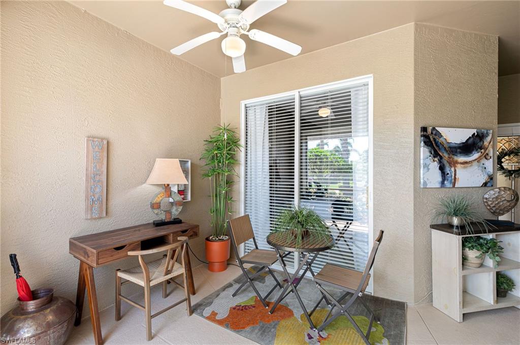 21445 Knighton Run Estero, FL 33928 - Photo 35 of 48 a living room with furniture and a potted plant