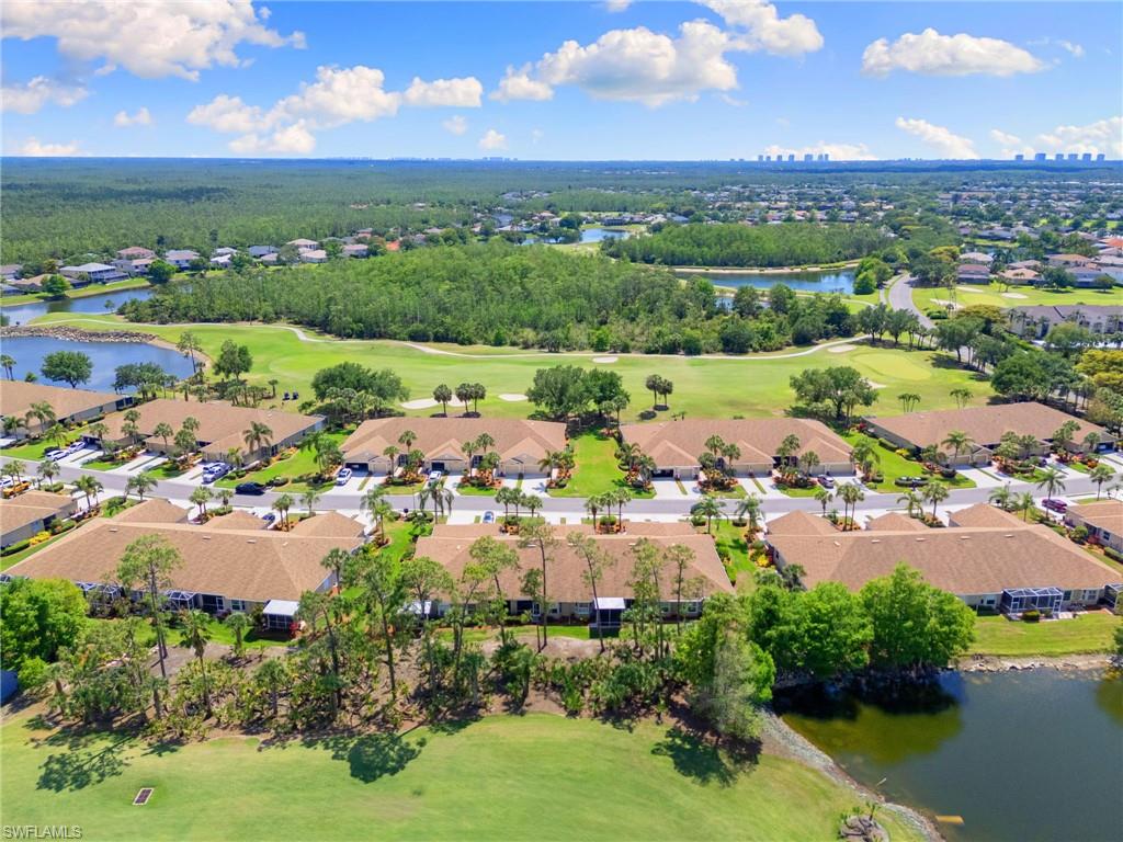 21445 Knighton Run Estero, FL 33928 - Photo 42 of 48 an aerial view of residential houses with outdoor space and lake view