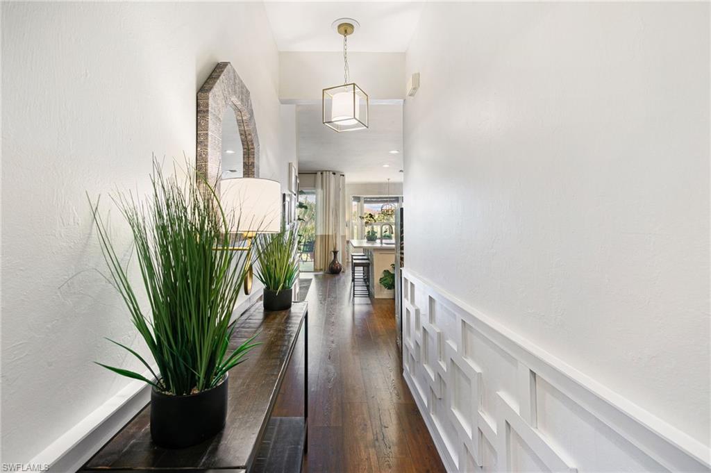 21445 Knighton Run Estero, FL 33928 - Photo 7 of 48 a view of a hallway to a livingroom with furniture