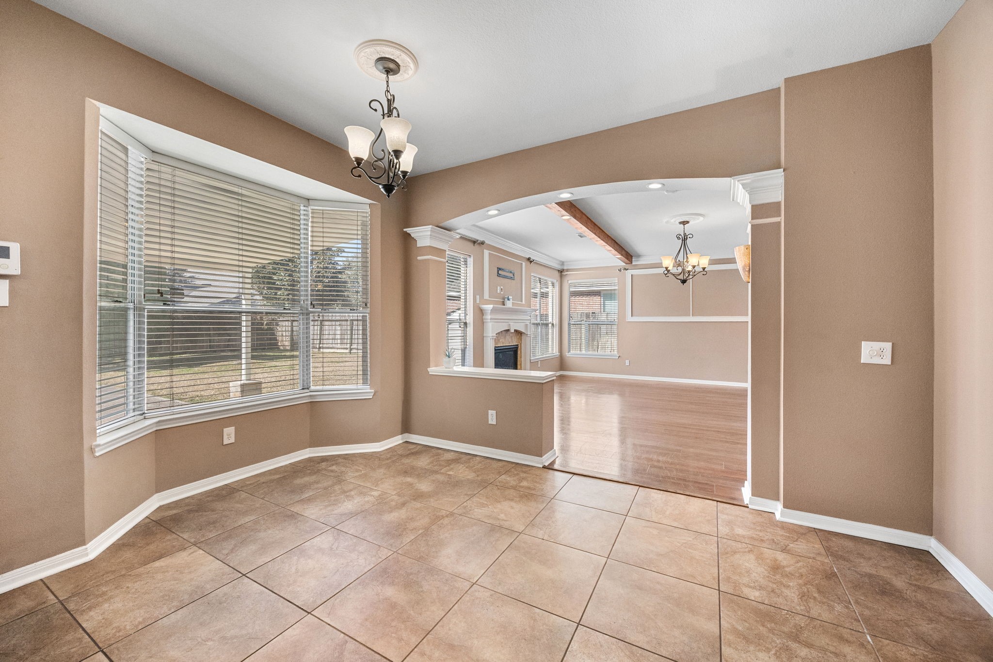 20407 Spring Rose Drive Katy, TX 77450 - Photo 12 of 33 A large breakfast nook sits just off the kitchen, featuring a big window overlooking the backyard. Flooded with natural light, this cheerful space is perfect for casual dining while enjoying views of the outdoors.