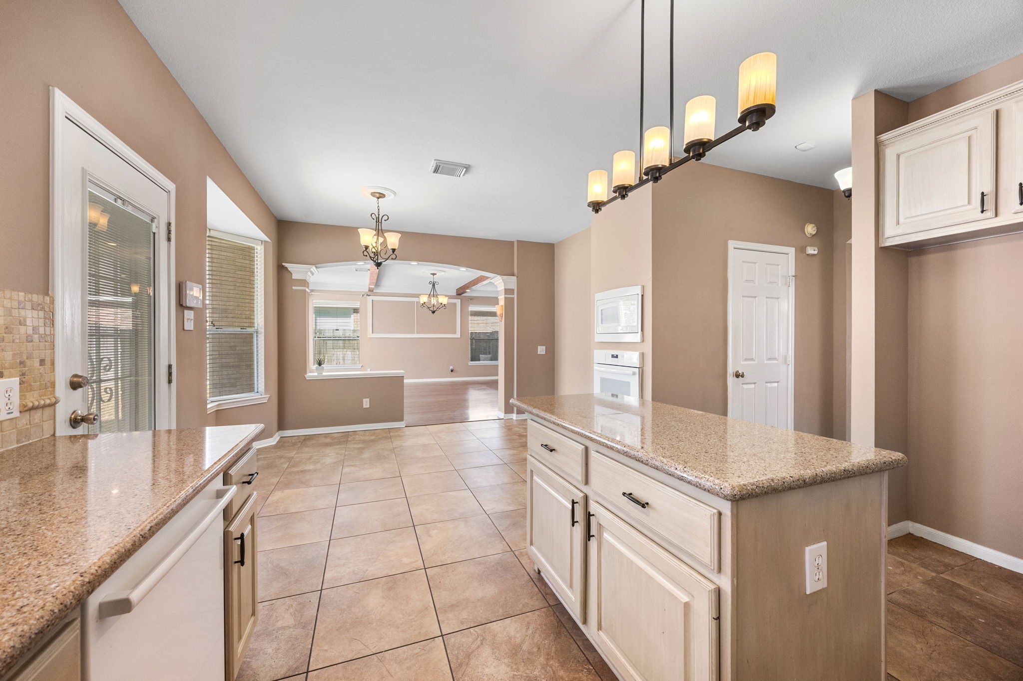 20407 Spring Rose Drive Katy, TX 77450 - Photo 15 of 33 This is a look from the kitchen into the expansive living room area. The door to the backyard is to the left.
