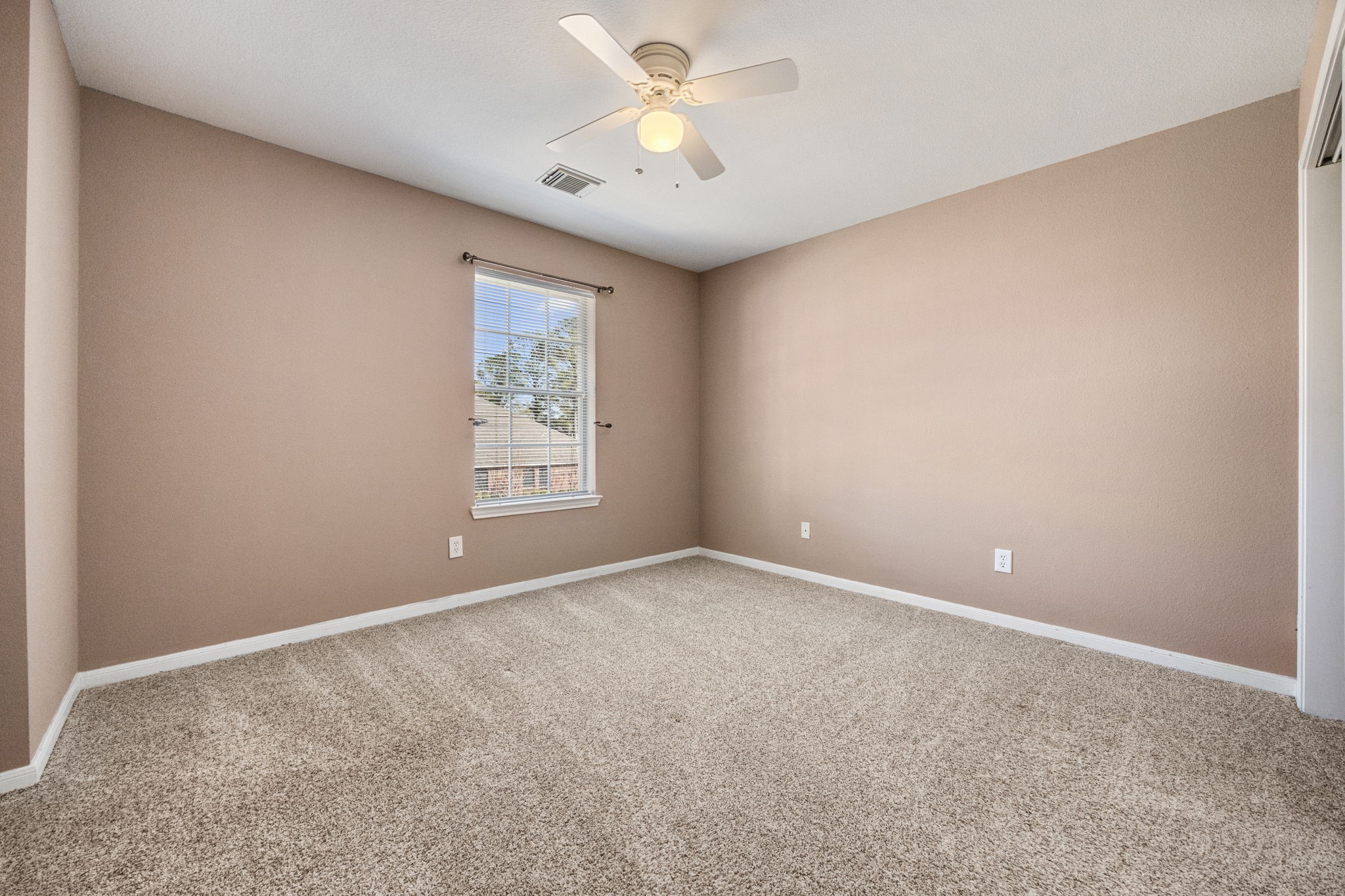 20407 Spring Rose Drive Katy, TX 77450 - Photo 27 of 33 Here's another additional bedroom upstairs and as you can see, all of them have plenty of space!