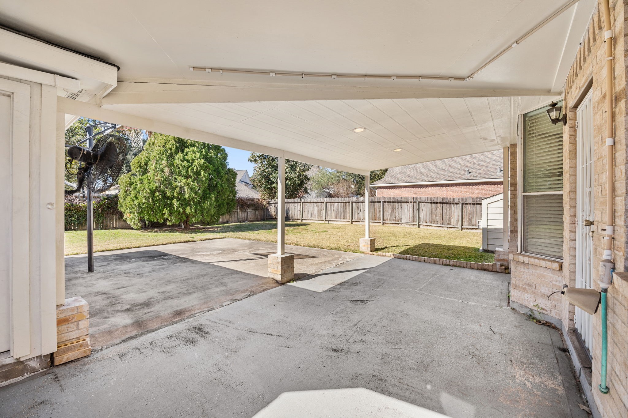20407 Spring Rose Drive Katy, TX 77450 - Photo 30 of 33 the large, covered patio area opens to the spacious backyard, imagine your cozy outdoor furniture in that space with the wonderful smell of barbecue on the grill!