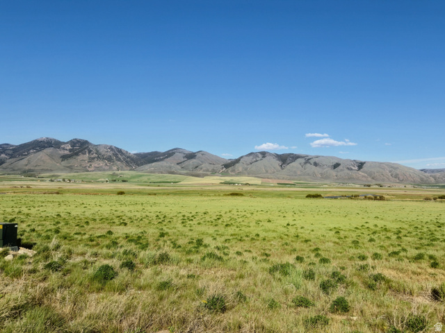 1800 Lower Bern Road, Unit 6 Bern, ID 83220 - Photo 4 of 8 Expansive open field with natural grasses and distant mountain formations under a clear blue sky