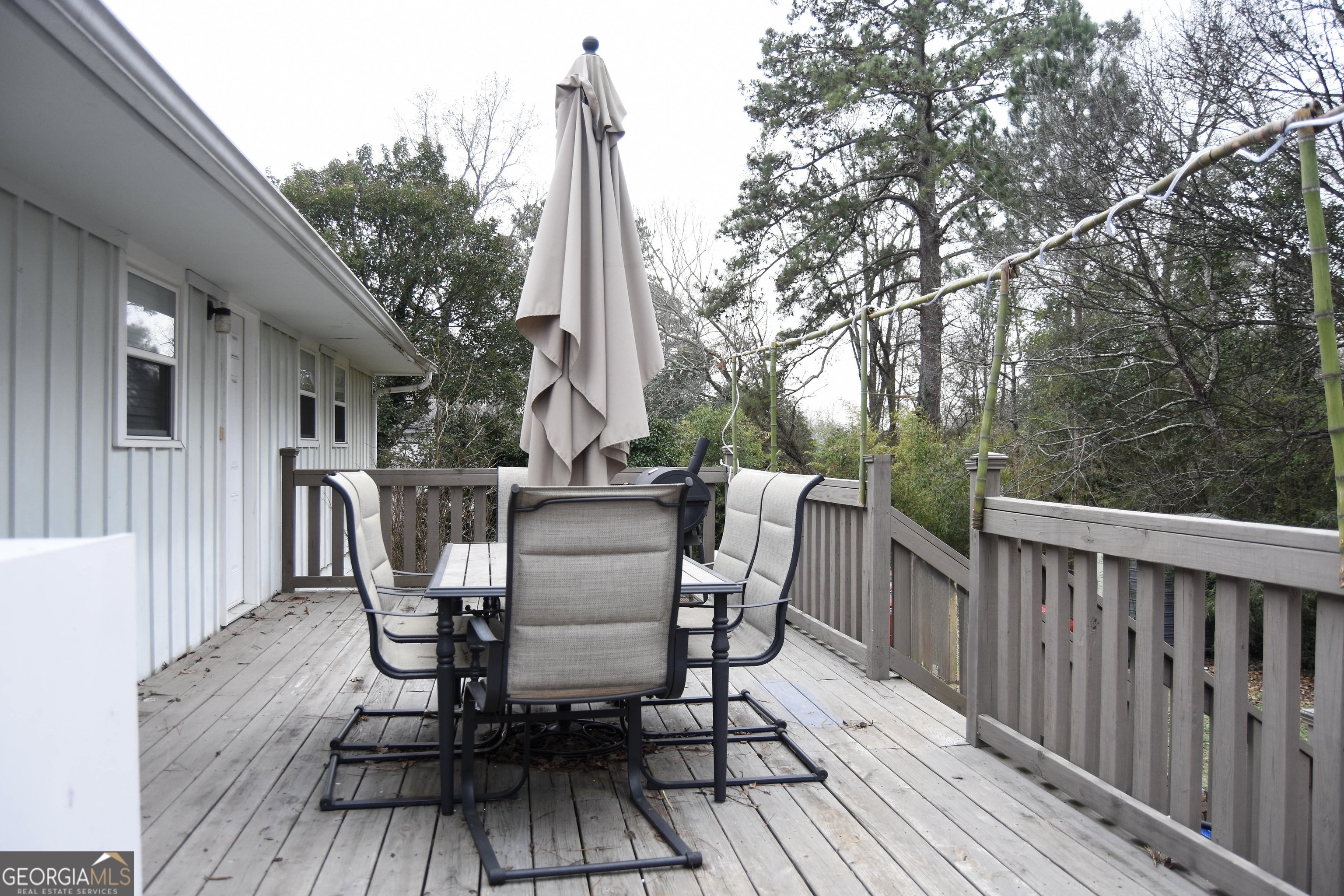 1508 Cloverdale Road Anniston, AL 36207 - Photo 18 of 19 a view of a deck with furniture and trees