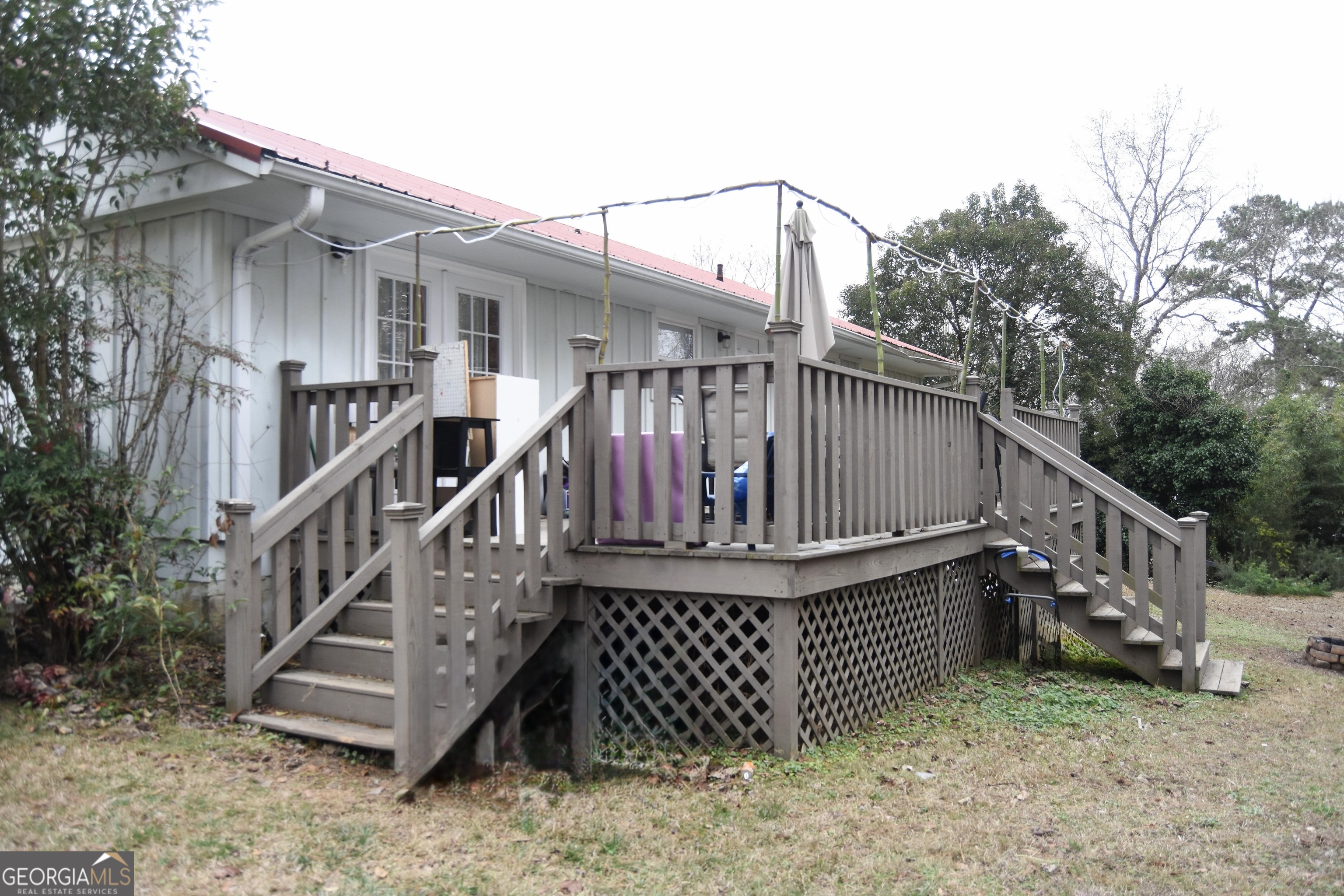 1508 Cloverdale Road Anniston, AL 36207 - Photo 19 of 19 a view of wooden house with a deck