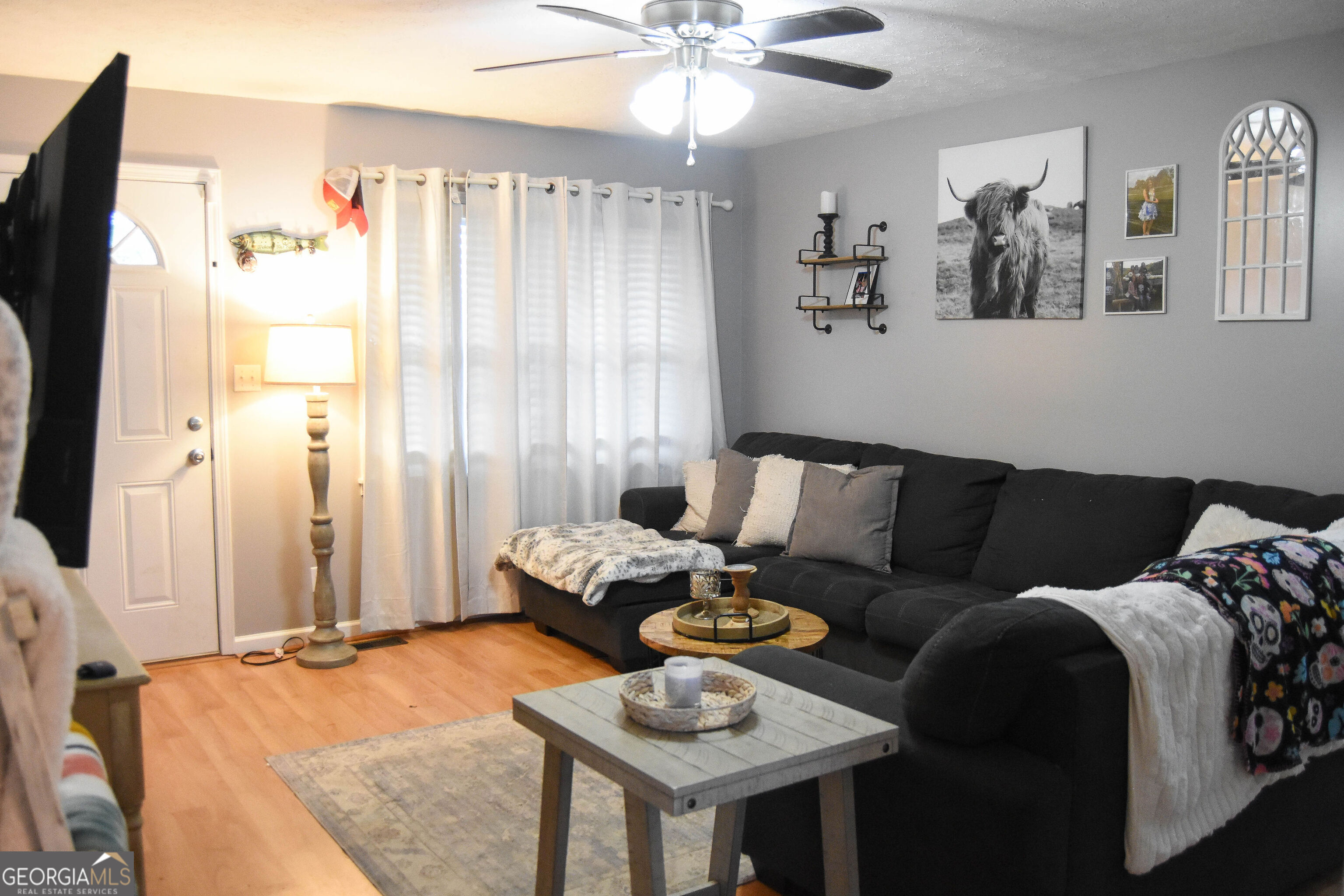 1508 Cloverdale Road Anniston, AL 36207 - Photo 2 of 19 a living room with furniture and a large window