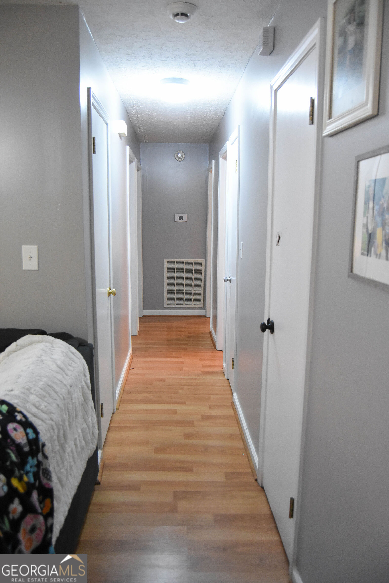 1508 Cloverdale Road Anniston, AL 36207 - Photo 10 of 19 a view of a hallway with wooden floor and staircase