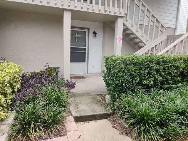 a kitchen with a refrigerator and a stove