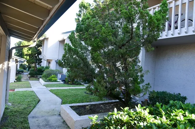 a backyard of a house with lots of green space