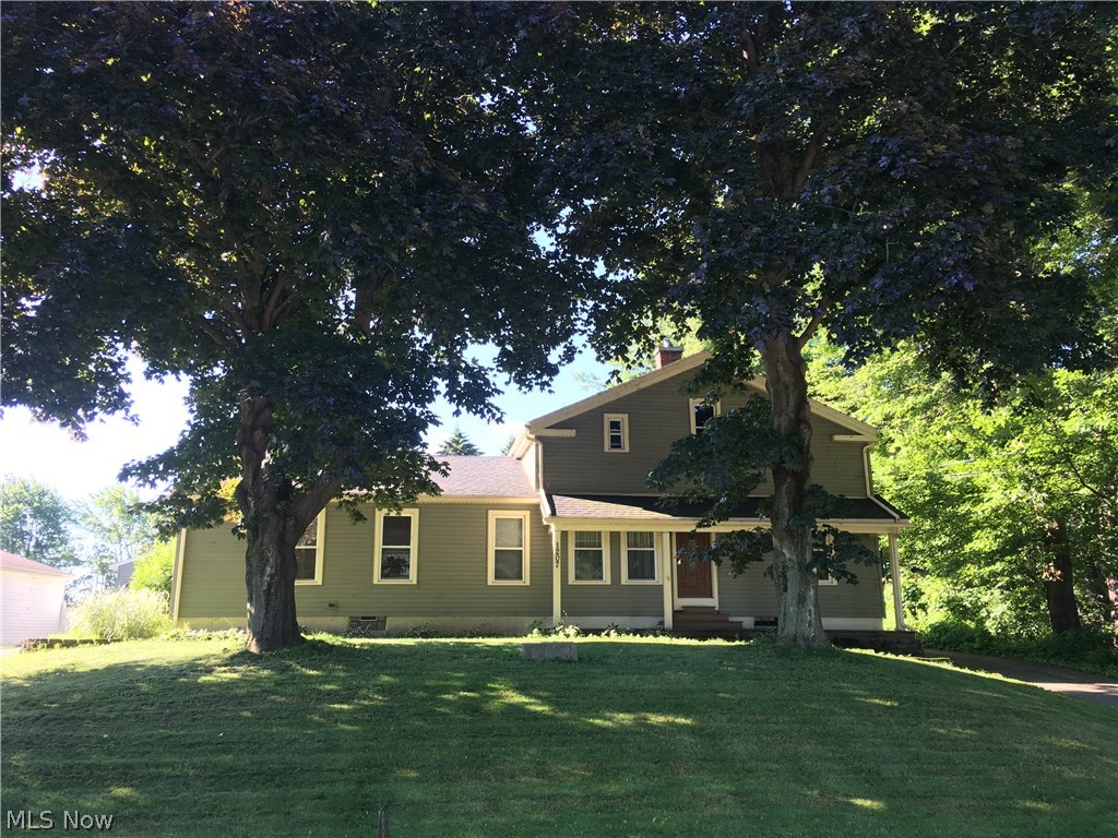 1207 Lake Road Conneaut, OH 44030 - Photo 1 of 33 Great Lake Road listing with beautiful shade trees and a great front porch.